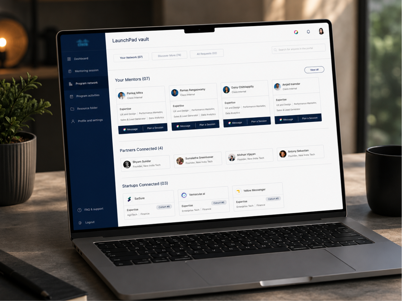 Cisco LaunchPad dashboard — program network showing mentors, partners and startups on a laptop