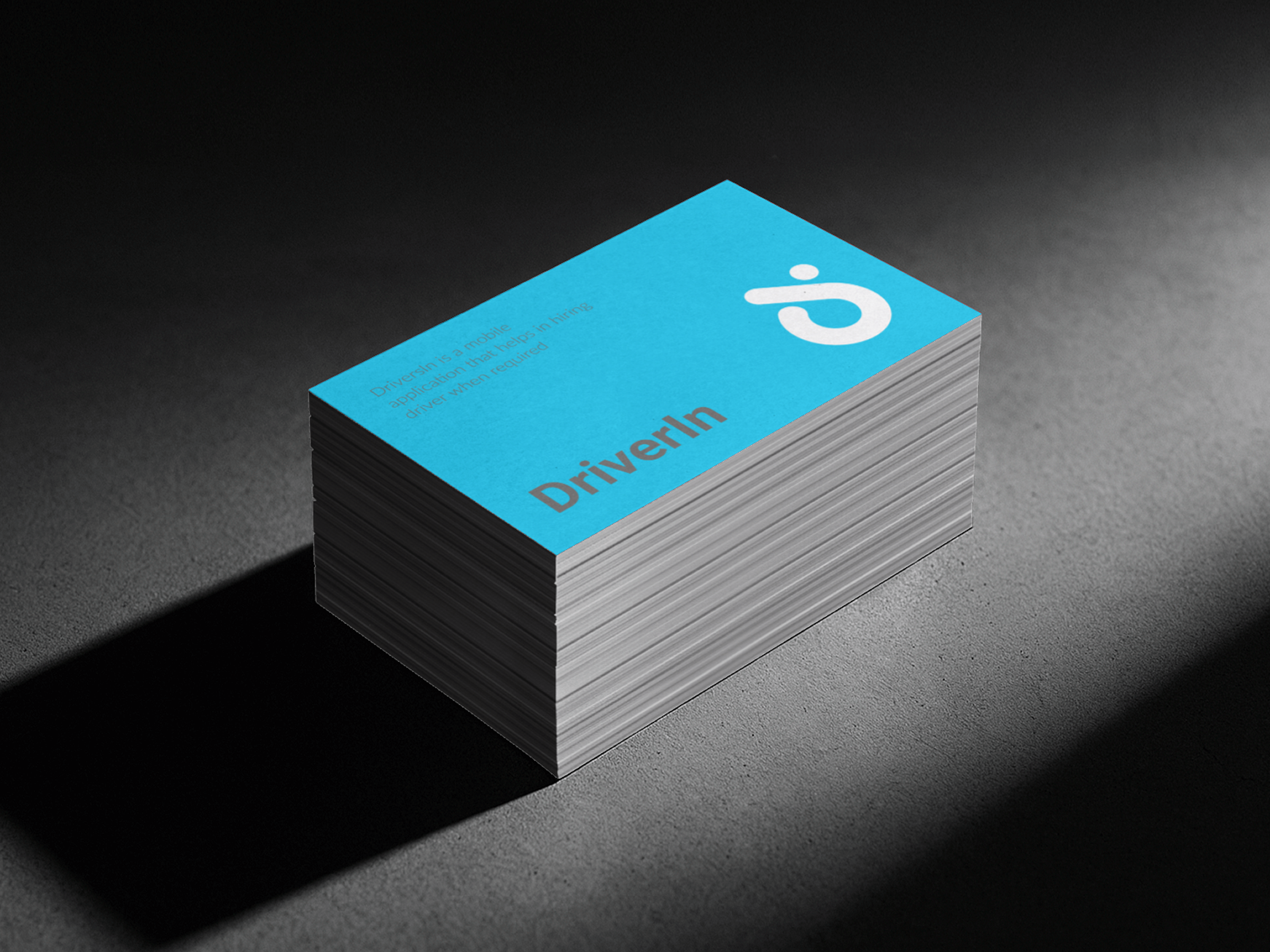 DriverIn branded business cards stacked, showing the logo and tagline