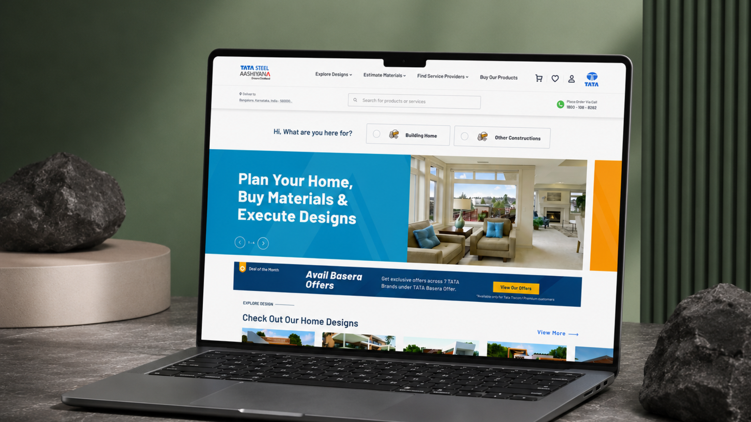 TATA STEEL Aashiyana homepage — plan your home, buy materials and execute designs, shown on laptop